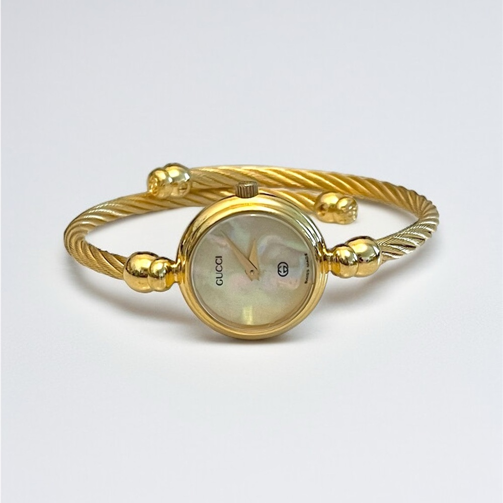 Gucci Gold Tone Mother-of-Pearl Twisted Rope Cable Bangle Watch